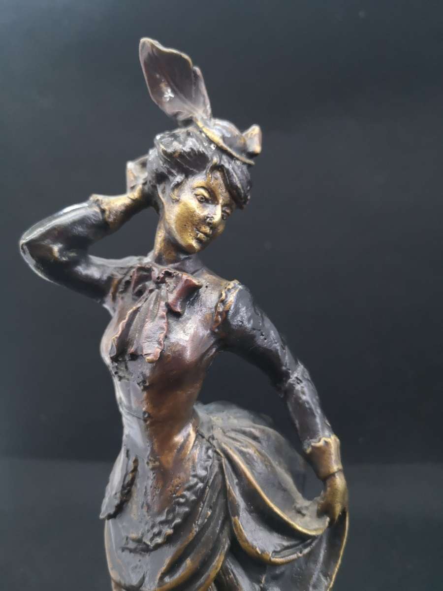 Heavy cast metal woman with sausage dog