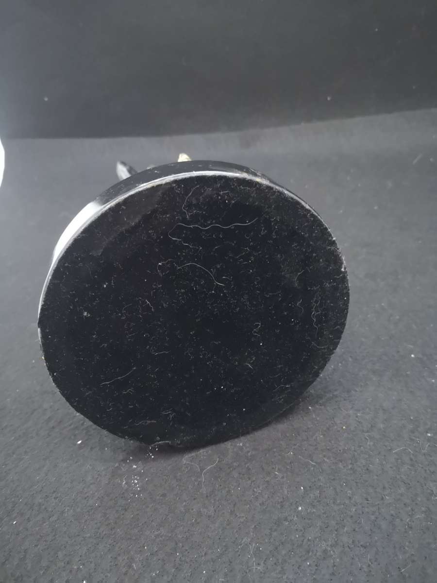 Heavy cast metal woman with sausage dog