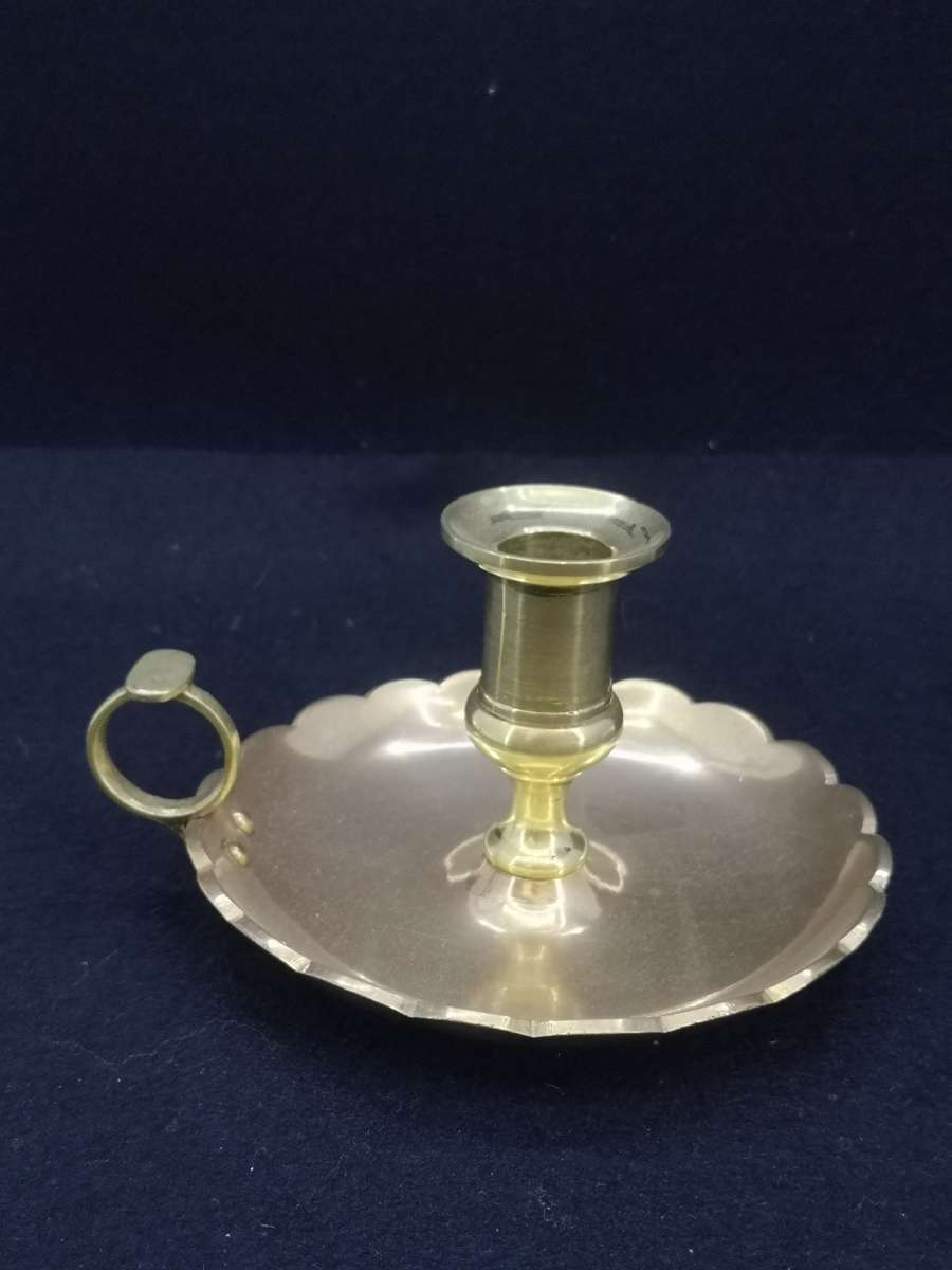 Solid antique brass candle holder/chamber stick