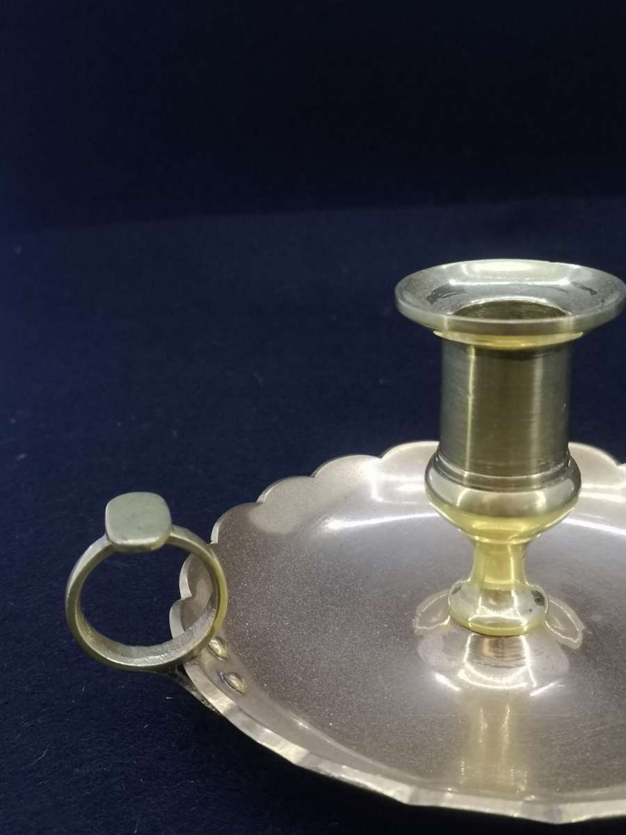 Solid antique brass candle holder/chamber stick