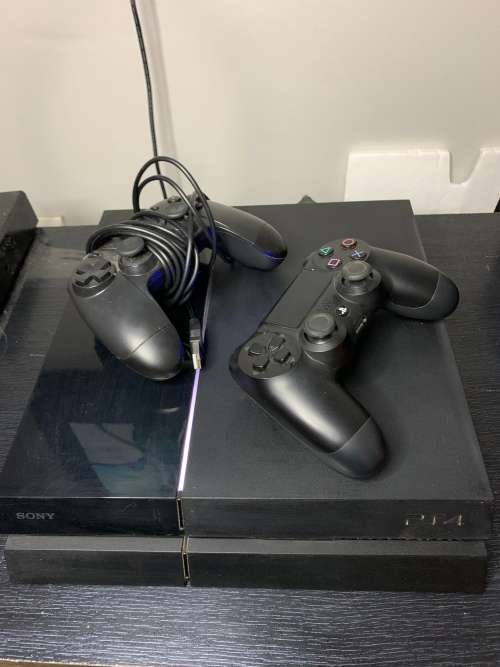 PlayStation 4 Original in original box with both a wired and wires less controller. Games included.