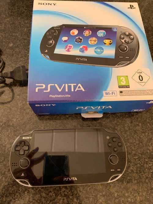 Sony PS Vita WiFi With 4Gb Memory Stick And Cover In Original Box + 4 Games.