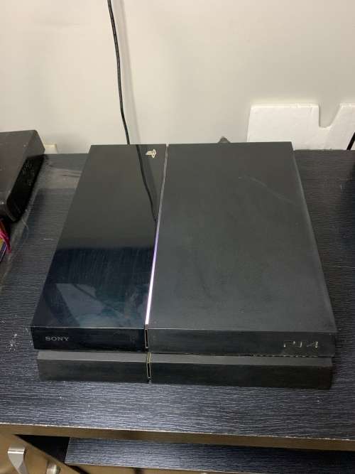 PlayStation 4 Original in original box with both a wired and wires less controller. Games included.