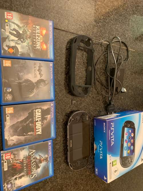 Sony PS Vita WiFi With 4Gb Memory Stick And Cover In Original Box + 4 Games.