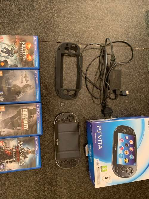 Sony PS Vita WiFi With 4Gb Memory Stick And Cover In Original Box + 4 Games.