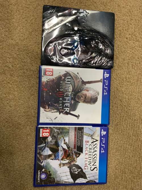 PlayStation 4 Original in original box with both a wired and wires less controller. Games included.