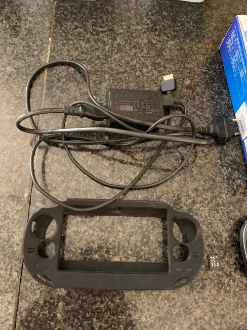 Sony PS Vita WiFi With 4Gb Memory Stick And Cover In Original Box + 4 Games.