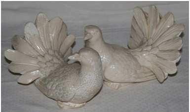 A SET OF RESIN IVORY DOVES