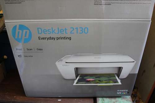 New & Unused HP Deskjet 2130 Printer,scanner & Copier. Includes brand new unopened ink set.