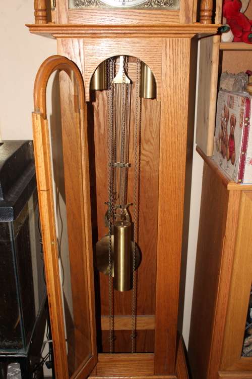 Stunning 2 metre solid Rhodesian Oak Grandfather clock 5 day movement(chimes need servicing)