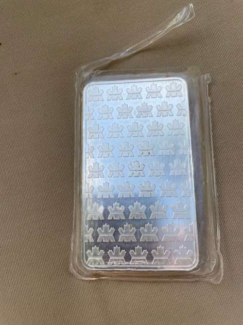 10 ounce solid silver Canadian Royal Mint bar opened circulated