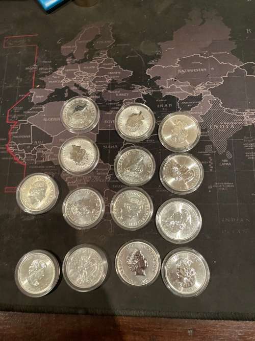 14 one ounces various pure silver 0.999 uncirculated coins of various government mints