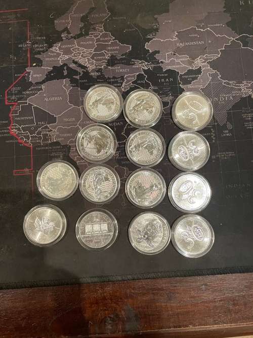 14 one ounces various pure silver 0.999 uncirculated coins of various government mints