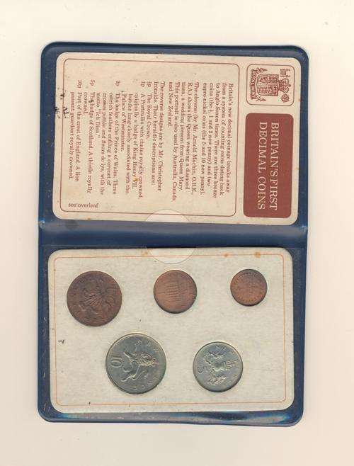 BRITISH FIRST DECIMAL 5 COIN SET IN BLUE PLASTIC WALLET.
