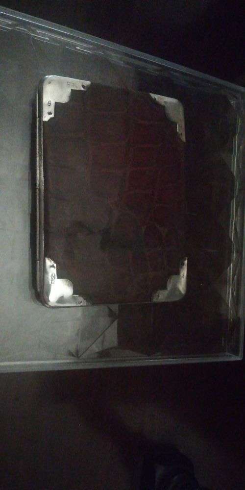 A crocodile skin wallet with hallmarked silver corners