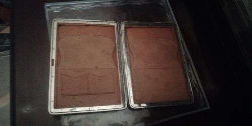 A crocodile skin wallet with hallmarked silver corners