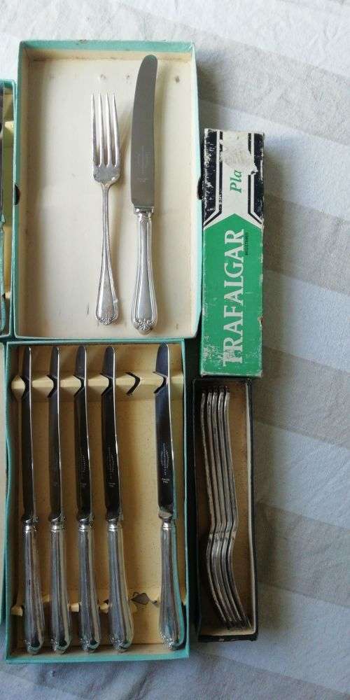 A vintage cutlery set as good as new in original boxes