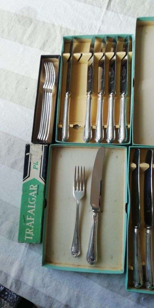 A vintage cutlery set as good as new in original boxes