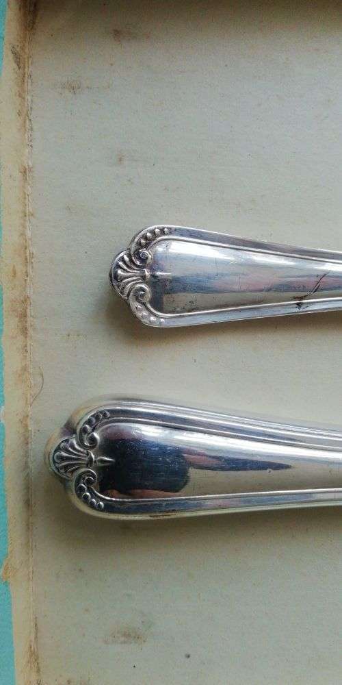 A vintage cutlery set as good as new in original boxes