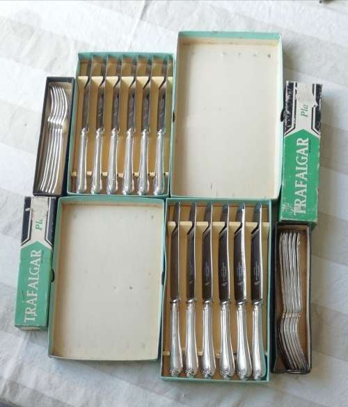 A vintage cutlery set as good as new in original boxes
