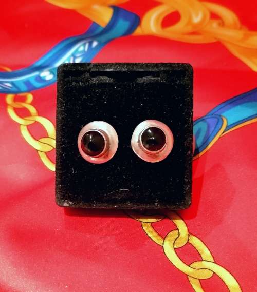 A stunning mid century pair of sterling silver onyx studs