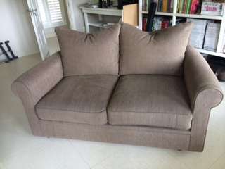 Two seater, fully restored couch on auction