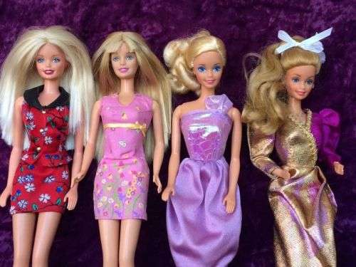 Four Classic Barbie Dolls with Great Outfits