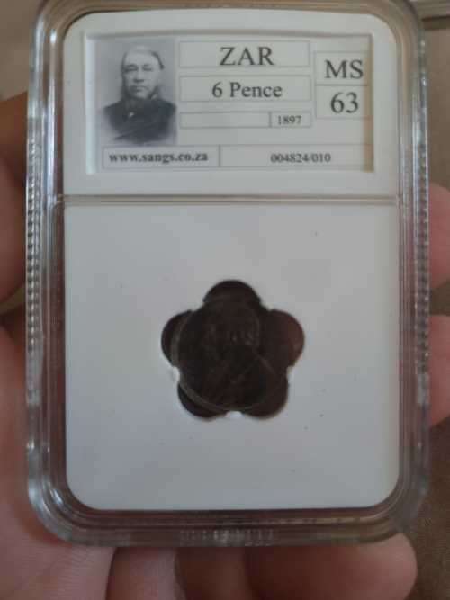 Beautiful, rainbow toned 1897 MS63 6d