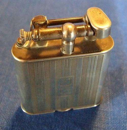 Old Art Deco silver plated Dunhill Unique lift-arm cigarette lighter.
