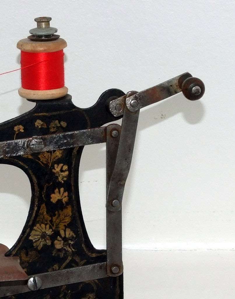 Antique miniature chain stitch sewing machine, working.