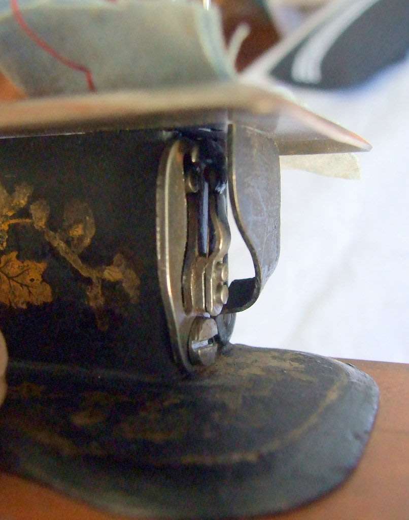 Antique miniature chain stitch sewing machine, working.