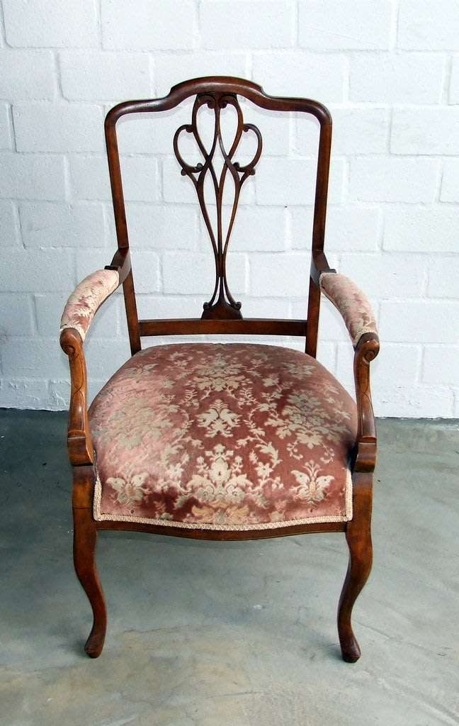 Antique Elbow (Carver) Chair in sturdy condition, fretwork damaged, probably Walnut.