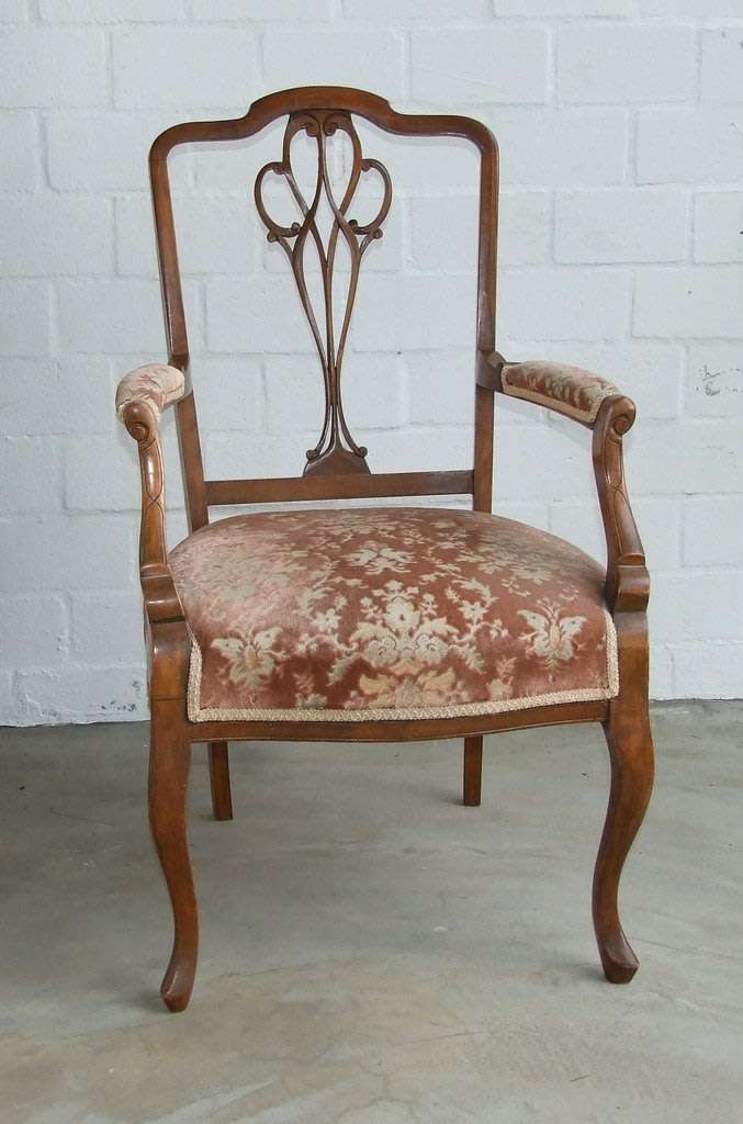 Antique Elbow (Carver) Chair in sturdy condition, fretwork damaged, probably Walnut.