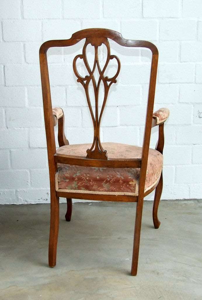 Antique Elbow (Carver) Chair in sturdy condition, fretwork damaged, probably Walnut.
