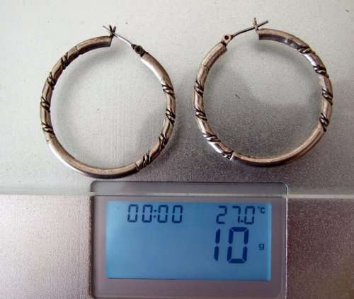 Classic vintage silver loop earrings.