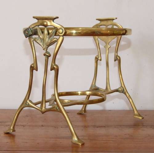 Art Nouveau brass warmer stand with hinged holder.