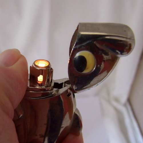Unusual, hefty (83grams) Piezo Jet dolphin lighter, working.