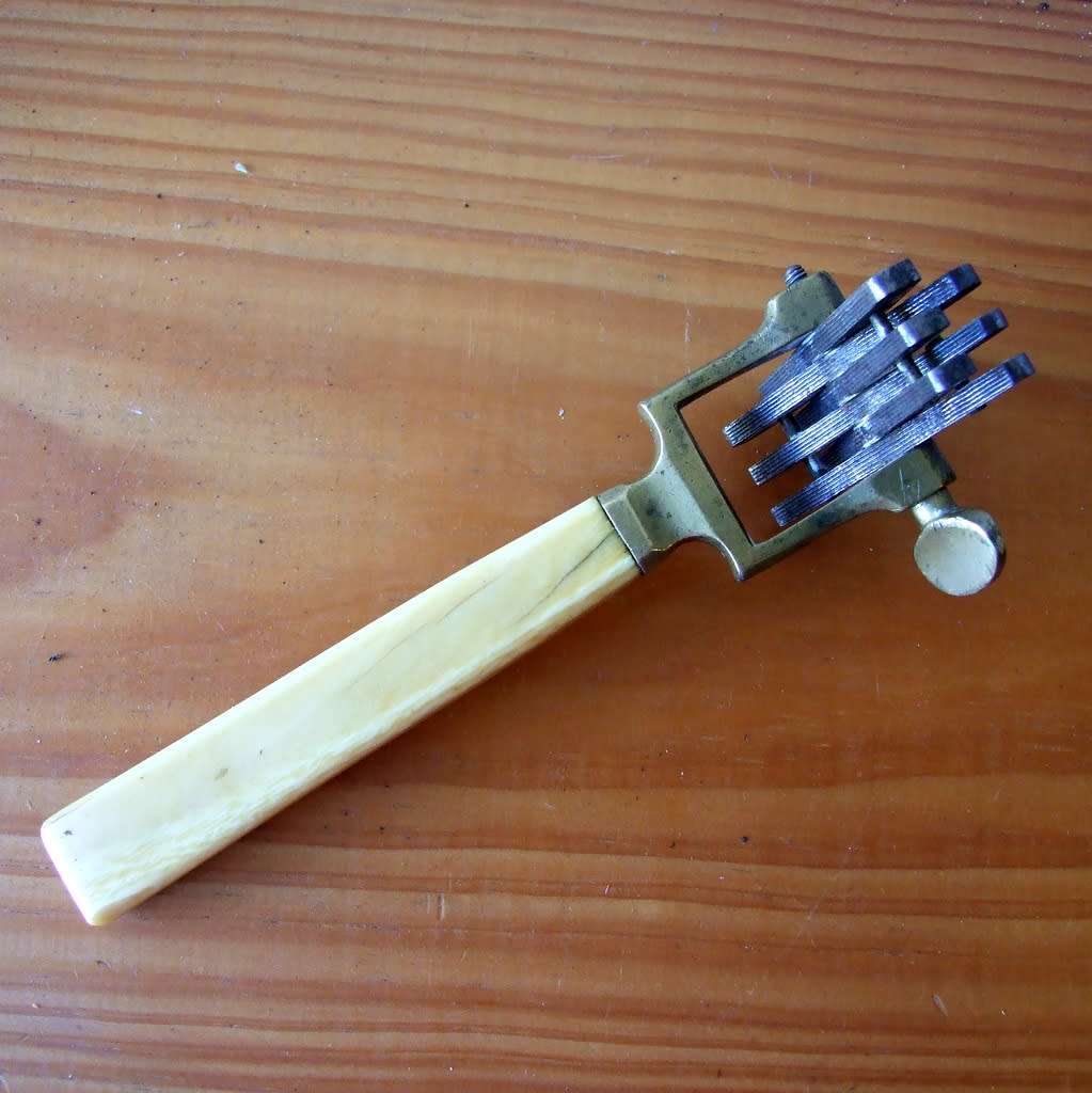 Very rare antique bone, brass and steel knife sharpening tool.