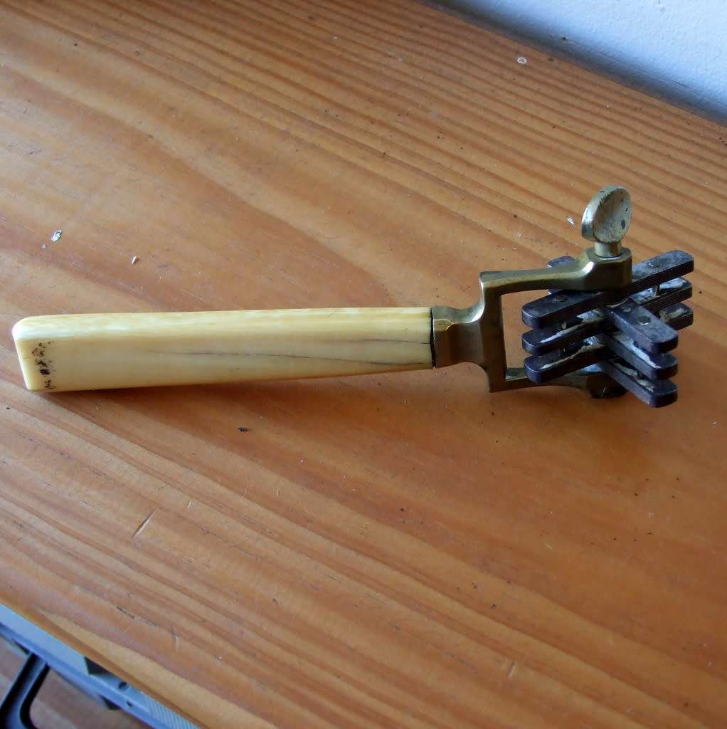 Very rare antique bone, brass and steel knife sharpening tool.
