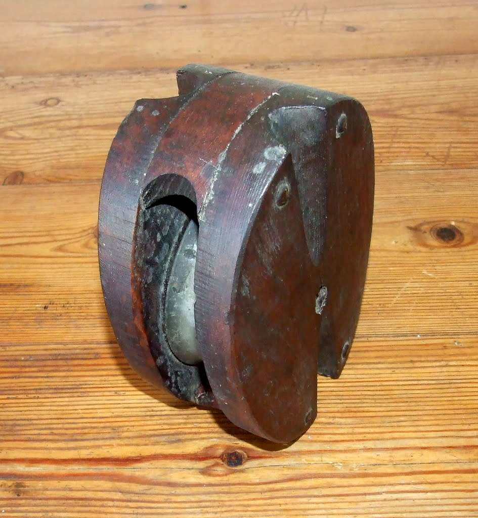 A vintage wood sailing block pulley