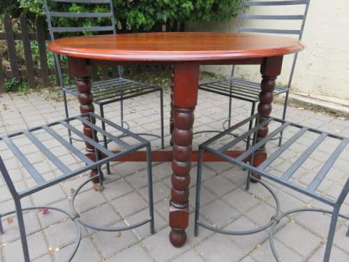 4 heavy wrought iron chairs.