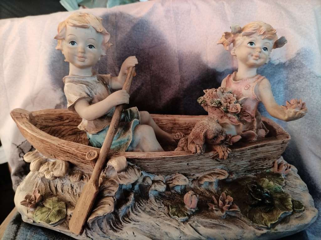 Vintage Boy and girl in a row boat