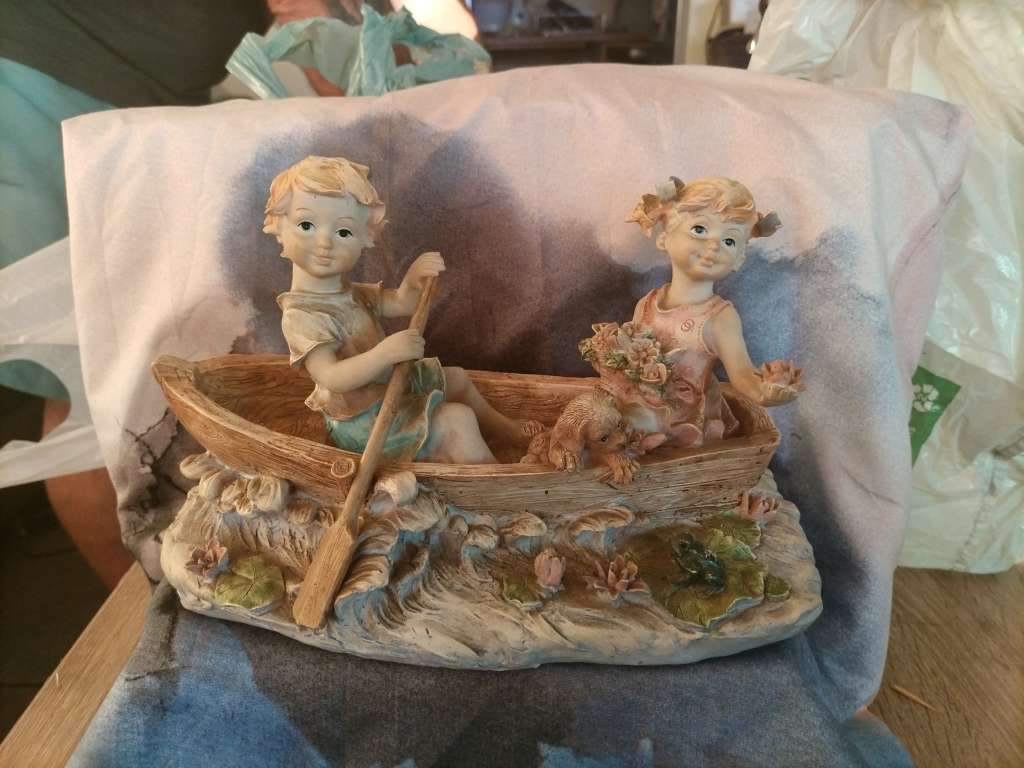 Vintage Boy and girl in a row boat