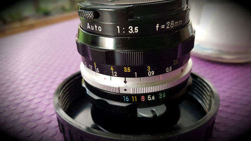 Vintage Nikon Nikkor-H Auto 1:3.5 f=28mm- 724953 Lens in Holder with caps