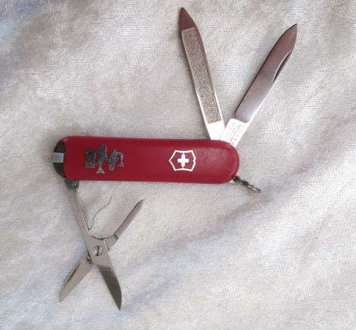 Vintage Victorinox Swiss  pocket knife with sheath - see condition piece of cover chipped off