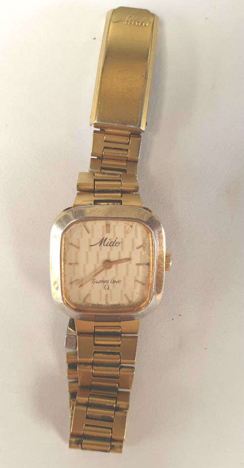 Vintage Swiss Made 1980`S MIDO Swing line Q Ladies Quartz watch  with Mido Strap-working