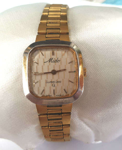Vintage Swiss Made 1980`S MIDO Swing line Q Ladies Quartz watch  with Mido Strap-working