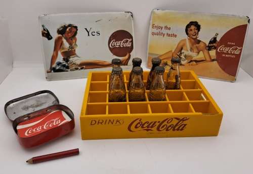 4 Vintage Coca Cola Items. Miniture Crate with 7 Coke bottles, 2 Metal Postcards and note Tin