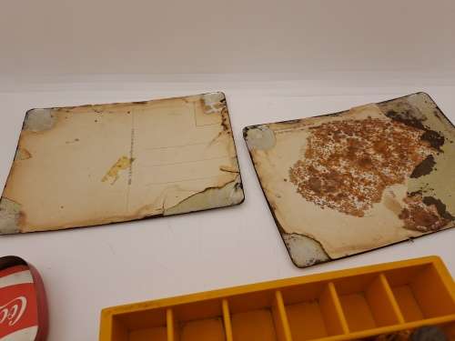 4 Vintage Coca Cola Items. Miniture Crate with 7 Coke bottles, 2 Metal Postcards and note Tin