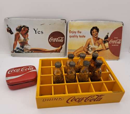 4 Vintage Coca Cola Items. Miniture Crate with 7 Coke bottles, 2 Metal Postcards and note Tin